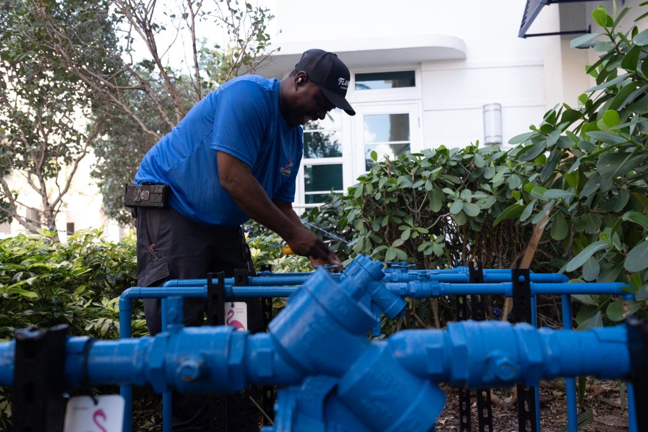 Flamingo technician working a plumbing job in the field