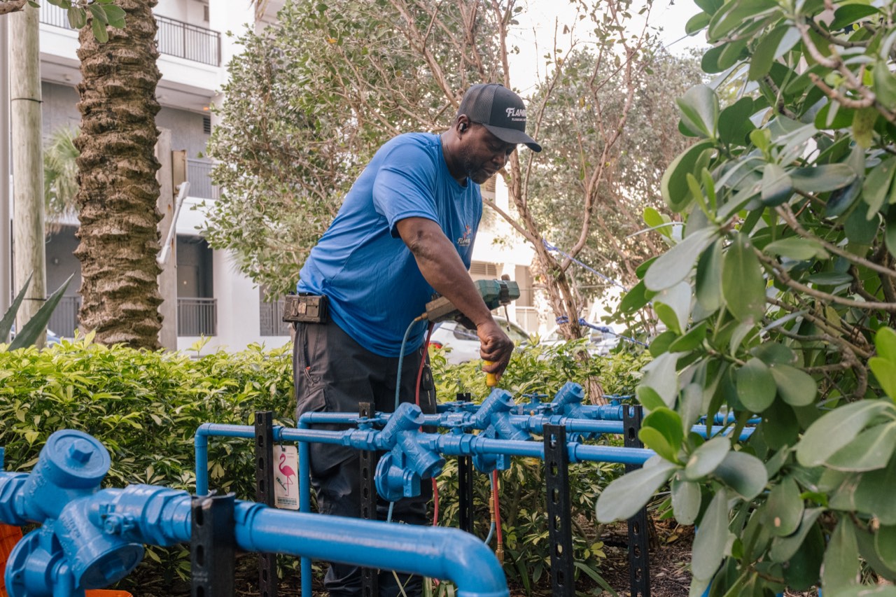 Flamingo technician testing a commercial backflow assembly on location in Fort Lauderdale, Broward County