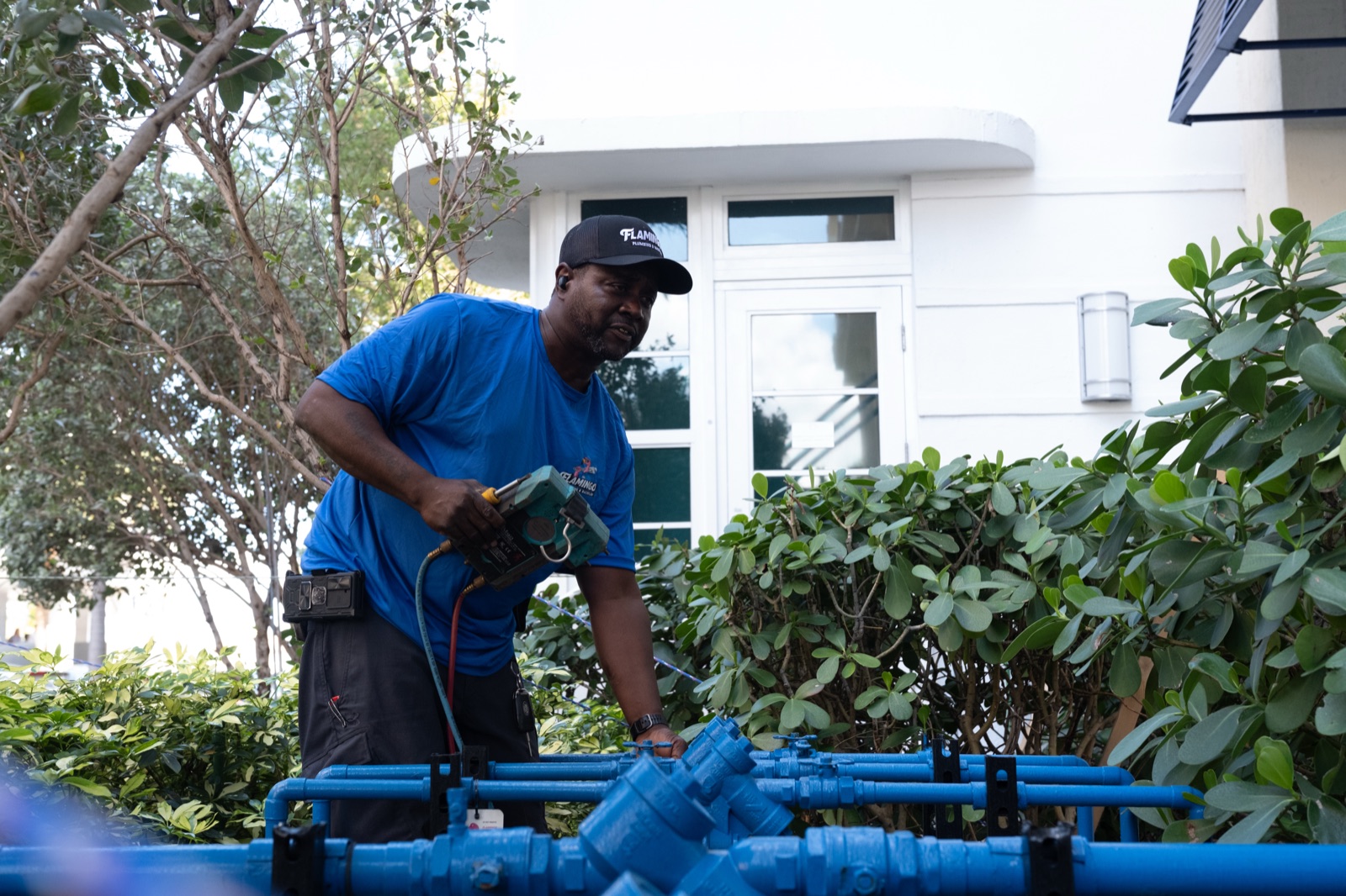 Flamingo technician working a water line in the field
